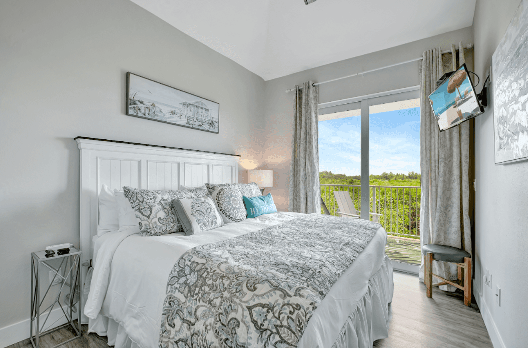 The soft linens cradle you like a cocoon, inviting you to unwind and let the worries of the day melt away.
