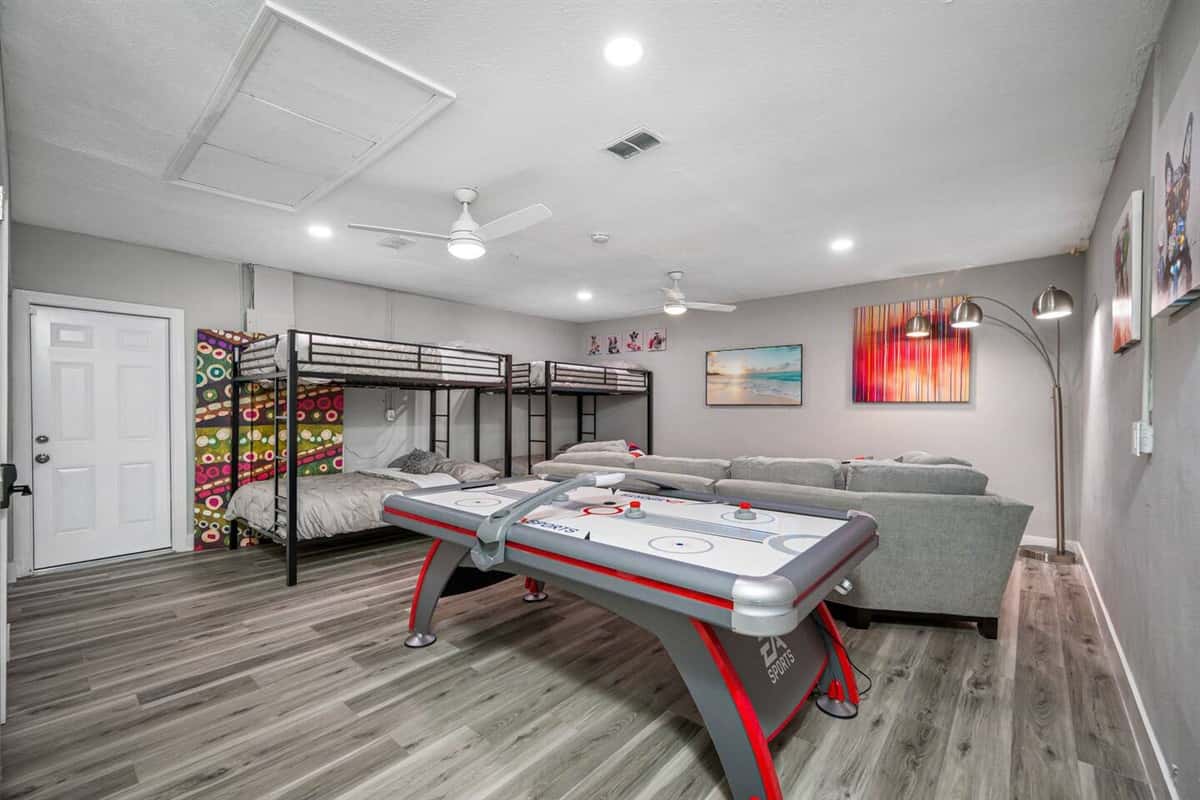 This lovely bedroom has enough sleeping space for kids and let them have their own space to watch movies they like and play games too.