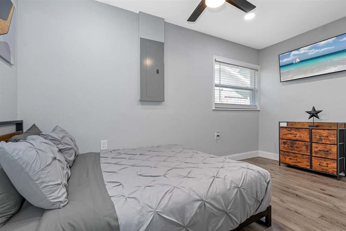 Watch movies in the comfort of your own bedroom while on this trip! This bedroom has a queen-sized bed, drawers for storage, and a smart TV! Book now!