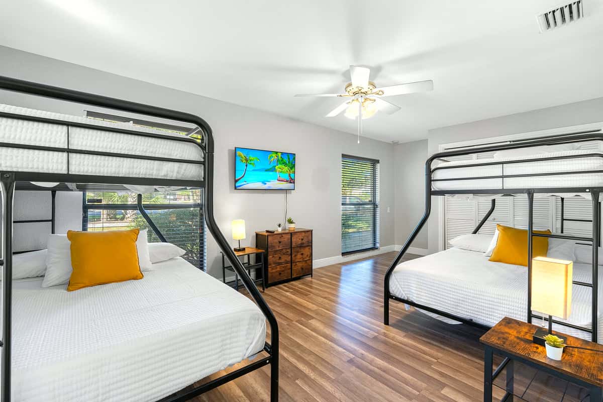 Ideal for families or groups, this roomy setup features two twin-over-full bunk beds for ultimate comfort.