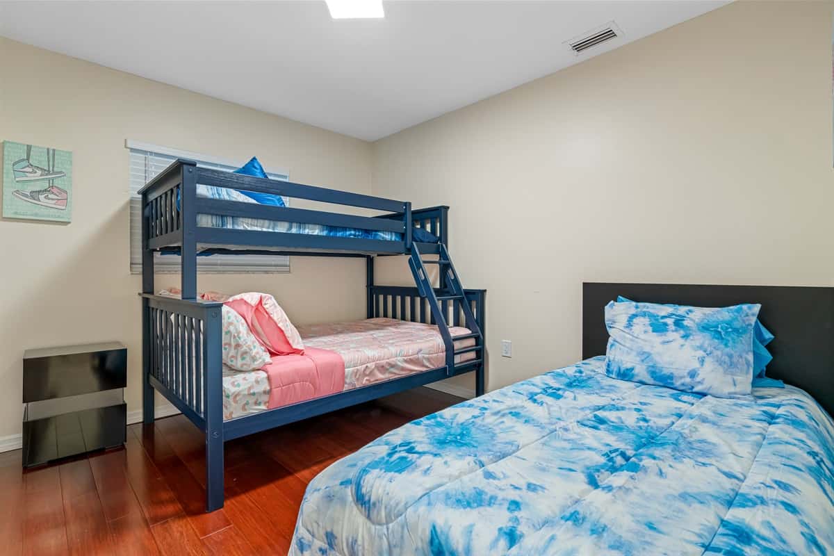 Welcome to this charming and cozy bedroom, perfect for family or friends to share.