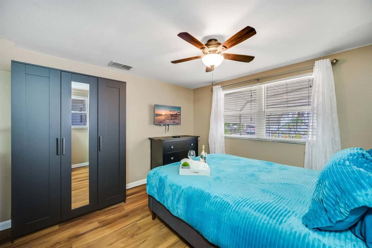 Impeccable bedroom with a queen sized bed, twin bunk bed, closet and a smart TV. Perfect for a group of friends or a family with kids.