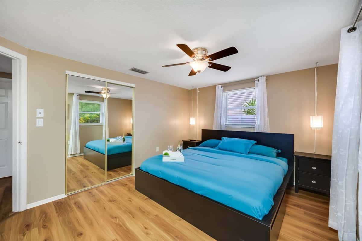 Comfortable bedroom with a king-sized bed, smart TV, and a full-size closet. Sleep safe and sound in the comfort of your home away from home. If you are interested in this property, send us an inquiry right away!