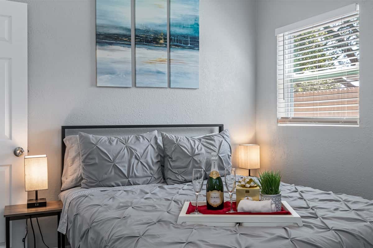 The inviting bed, with its soft linens and fluffy pillows, is the perfect place to unwind after a long day of exploring.