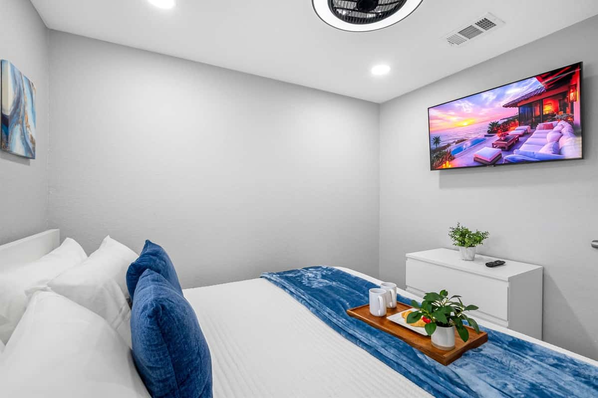 Natural light fills the room, complementing the refreshing blue tones and modern design.