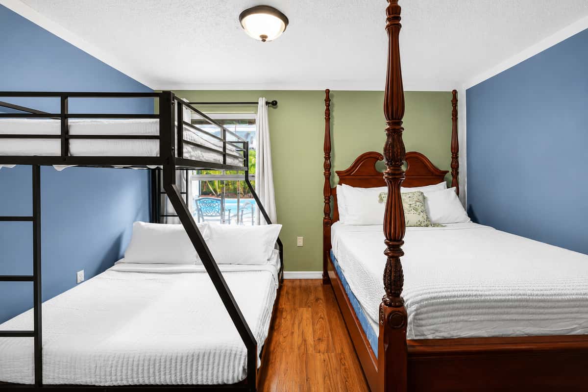 Spacious sleeping arrangements featuring a queen bed and a full-over-twin bunk bed, perfect for families and groups.