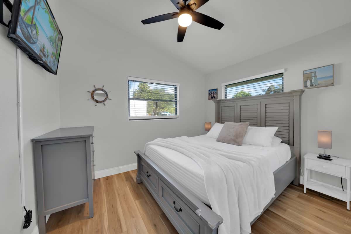 The second bedroom gives another couple a true retreat: a queen bed, Smart TV, ceiling fan, closet and enough room to unpack instead of living out of a suitcase.