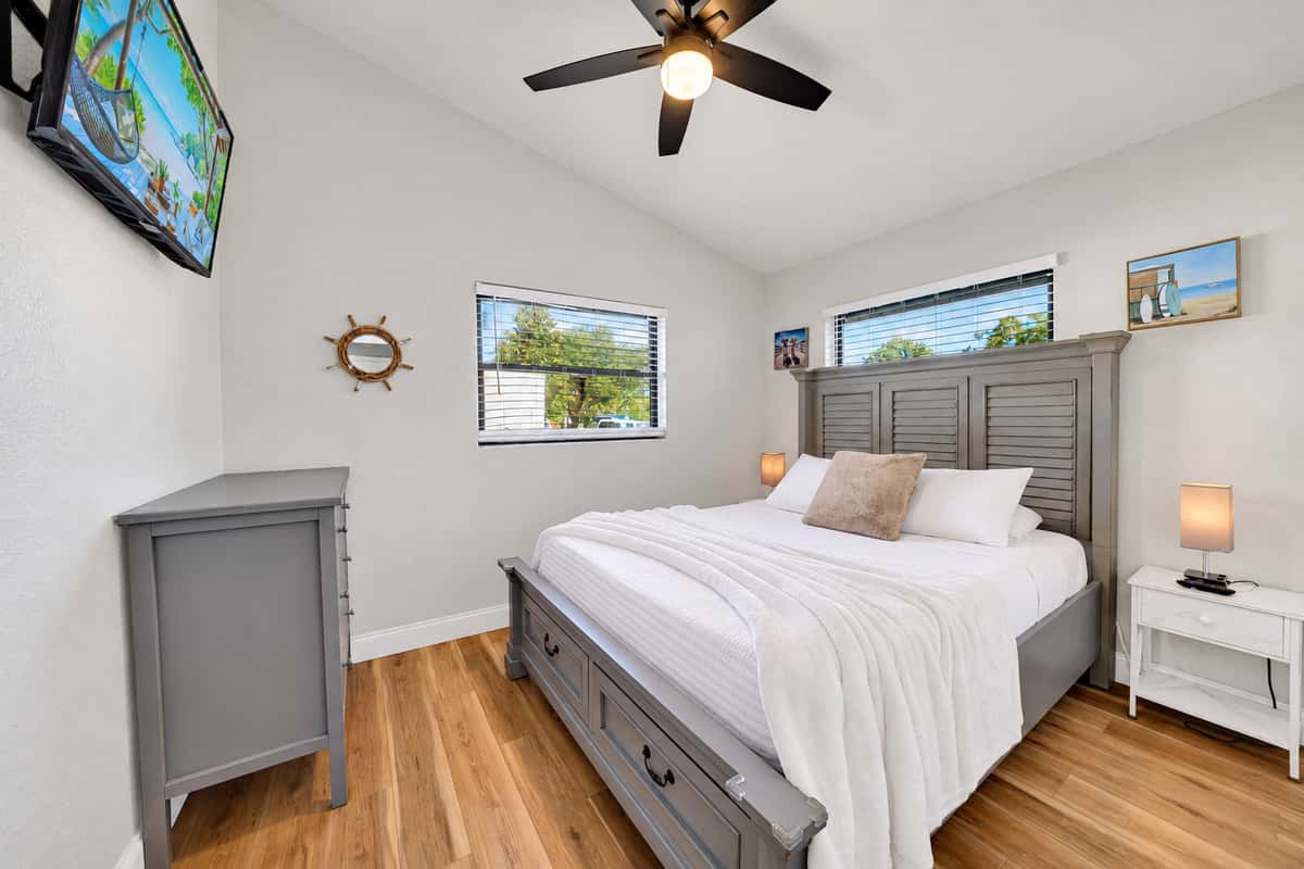 The second bedroom gives another couple a true retreat: a queen bed, Smart TV, ceiling fan, closet and enough room to unpack instead of living out of a suitcase.