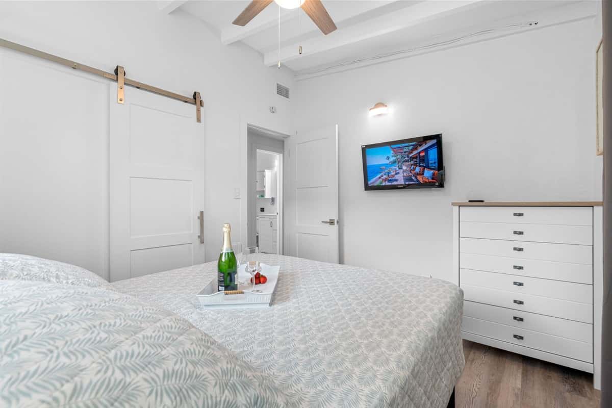 A smart TV is thoughtfully placed in the room, providing a variety of entertainment options at your fingertips.