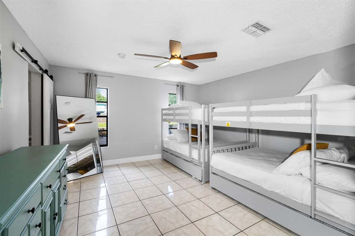 Whether you’re traveling with kids, cousins, or a crew of friends, this generously sized bunk room offers the perfect blend of comfort, space, and playful charm.