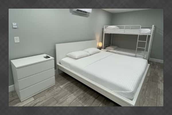Enjoy a bright and contemporary space equipped with a king bed and a twin bunk bed, ideal for adults and kids alike. *Updated photos will be added soon!