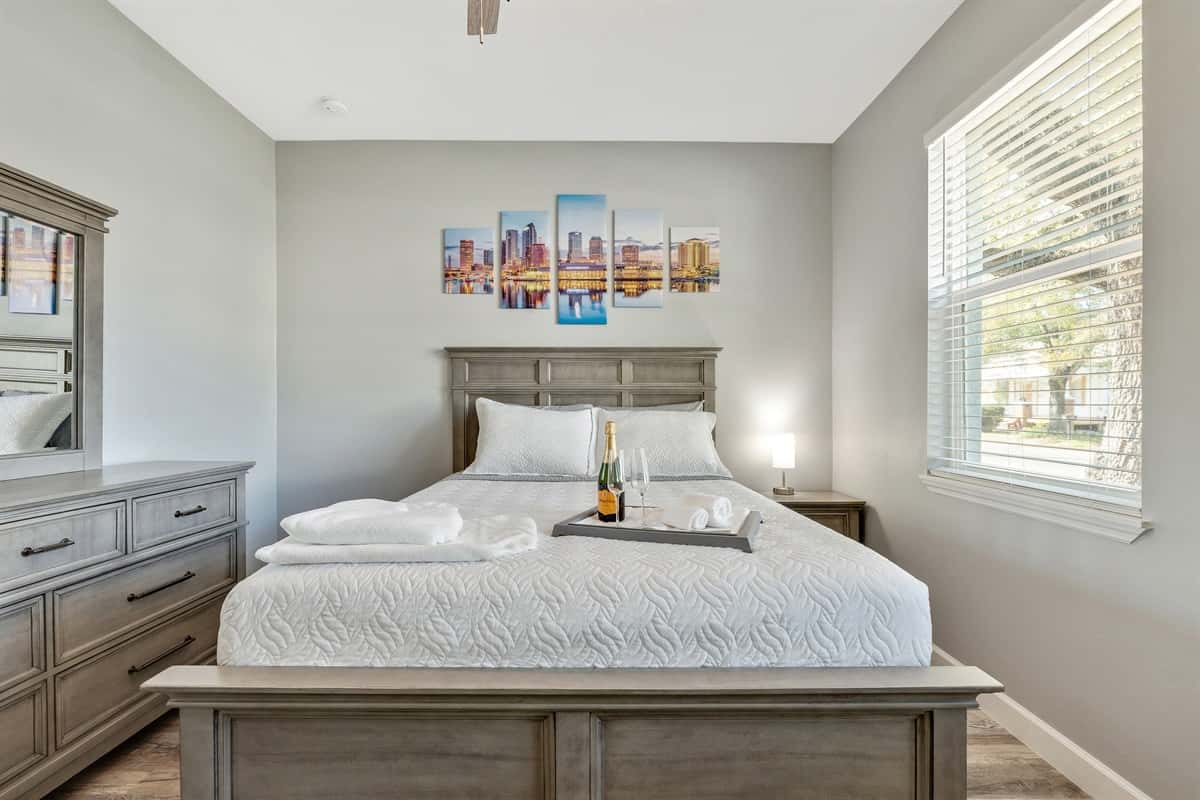 This bedroom exudes a warm and inviting atmosphere that invites you to settle in and make yourself at home.