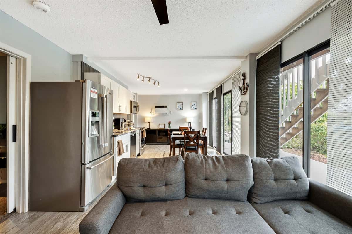 After a long day of exploring, you can unwind and relax on the plush and cozy gray sofa in the living area, which conveniently doubles as a pullout bed.