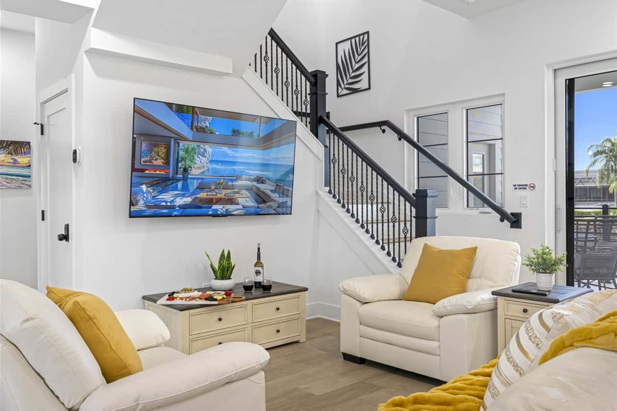 The comfortable seating arrangement, including plush sofas and armchairs, provides ample space for everyone to sit back and enjoy.