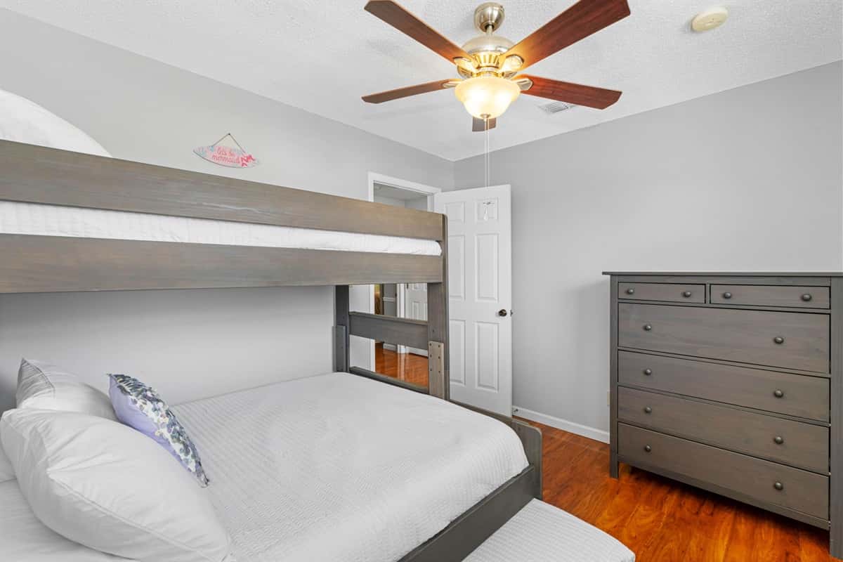 Twin XL over Queen bunk with Twin XL trundle — ideal for a small family or kids sharing a room.