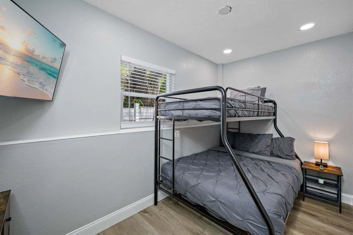 This beautiful room has a single over twin bunkbed, drawers for storage, and its own smart TV!