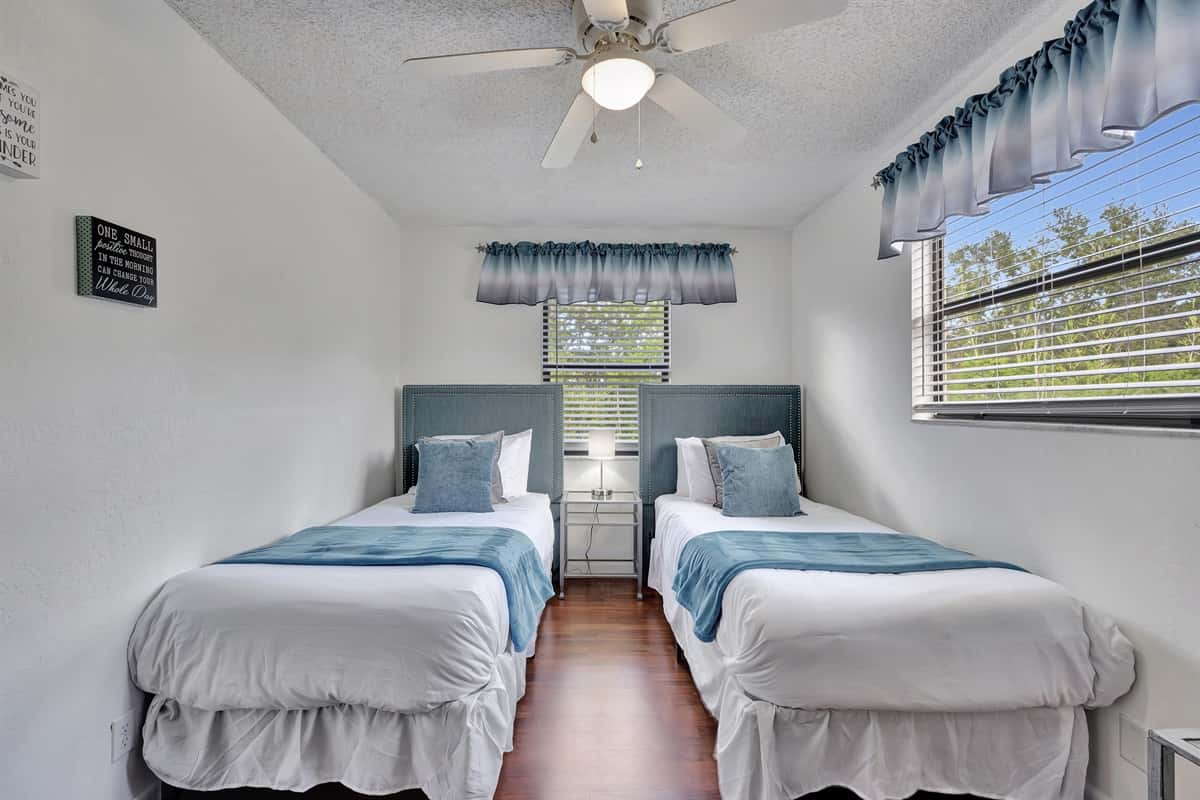 This inviting room features two cozy twin-size beds, making it perfect for accommodating guests of all ages, whether they are children, friends, or family members.