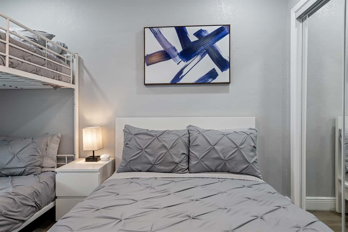 Our wonderful bedroom with a comfortable huge bed, a bunk bed and its own smart TV. Feel at home in your home away from home. If you think you'd enjoy your trip to this property, send us a message now!