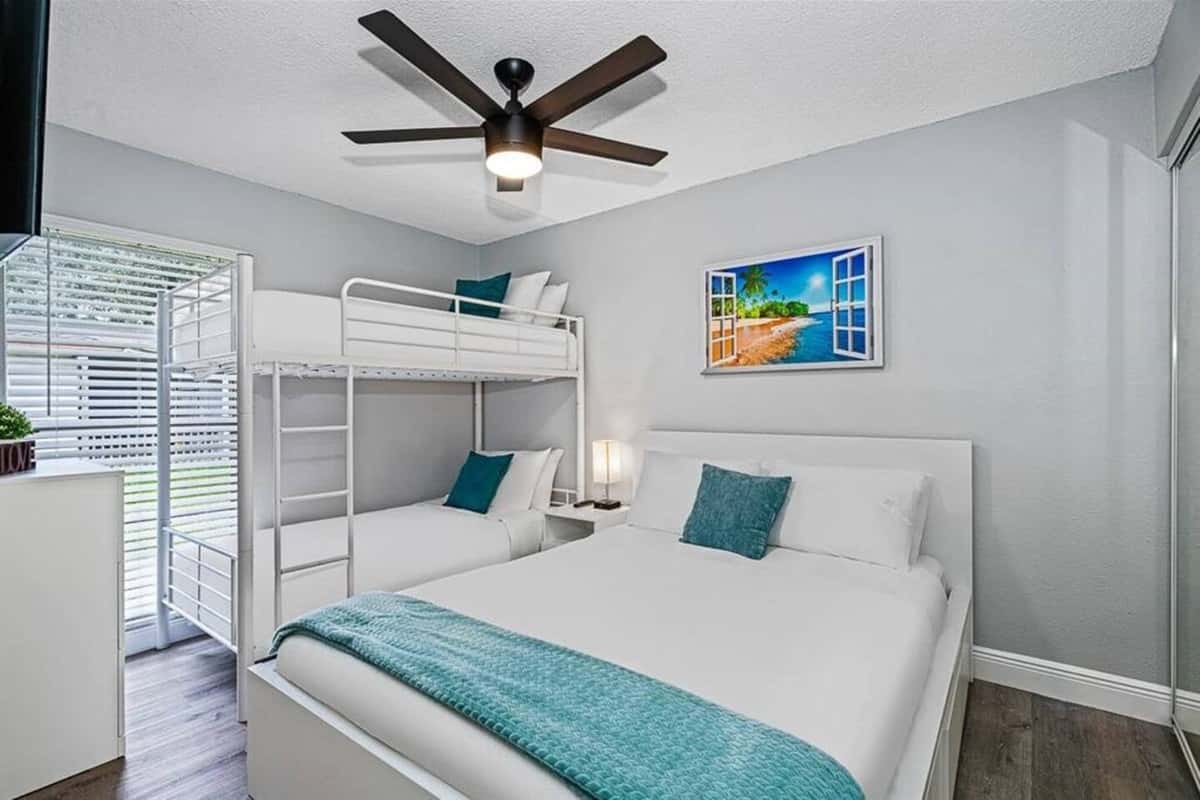 Perfect bedroom for a group of friends or small family with comfortable queen sized bed, single bunkbed, drawers for storage, and a smart TV. If you think this property suits your needs, send us an inquiry now!