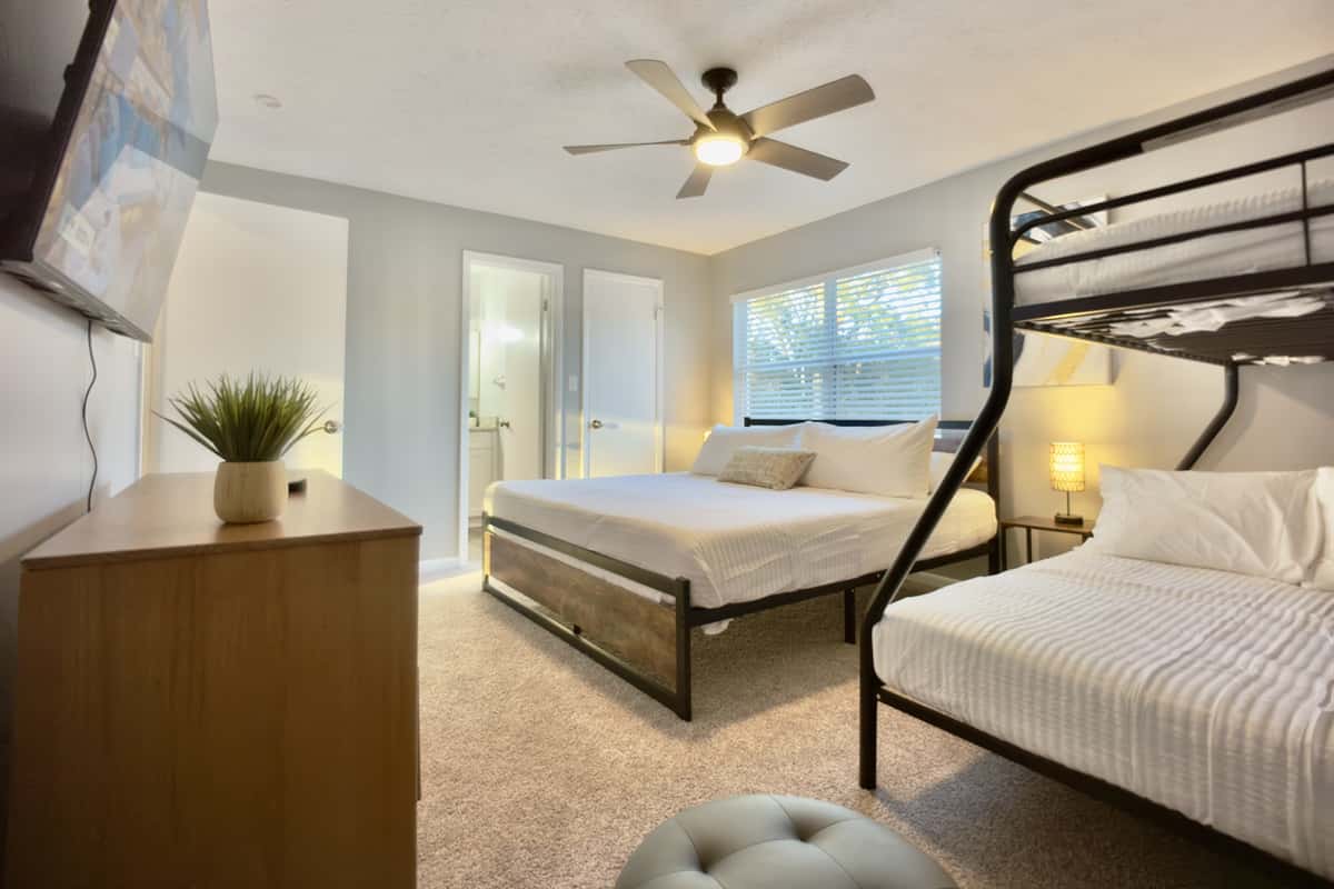 This bedroom offers a comfortable and flexible sleeping arrangement for families or groups.