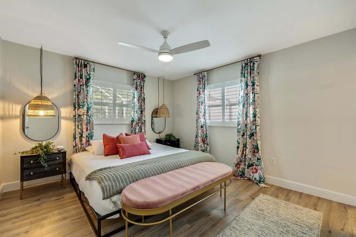 Dressed in luxurious linens and adorned with an array of plush pillows, the bed beckons you to sink into its comfort and unwind after a long day.