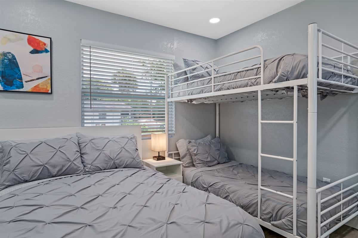 Magnificent bedroom with queen sized bed, single bunkbed, closets for storage and smart TV. Great room for families with kids or group of friends.