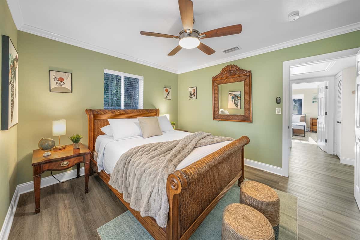 Designed for relaxation, this bedroom features a plush queen bed and a warm, homey feel.