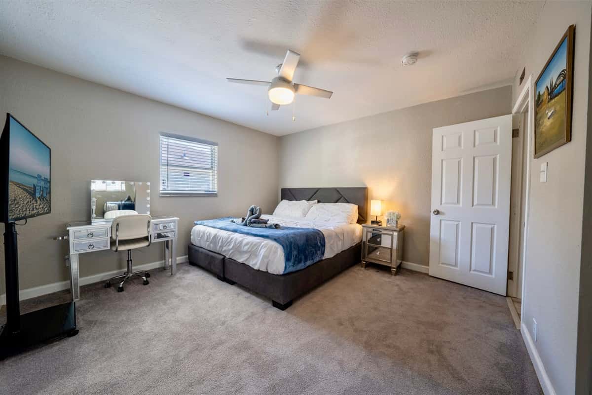 The centerpiece of this inviting bedroom is a luxurious king-size bed, promising a restful night's sleep and plenty of space to stretch out.