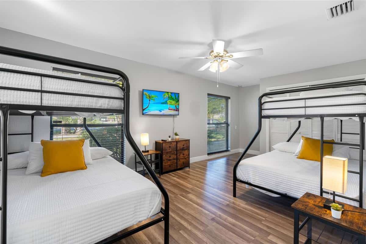 Ideal for families or groups, this roomy setup features two twin-over-full bunk beds for ultimate comfort.