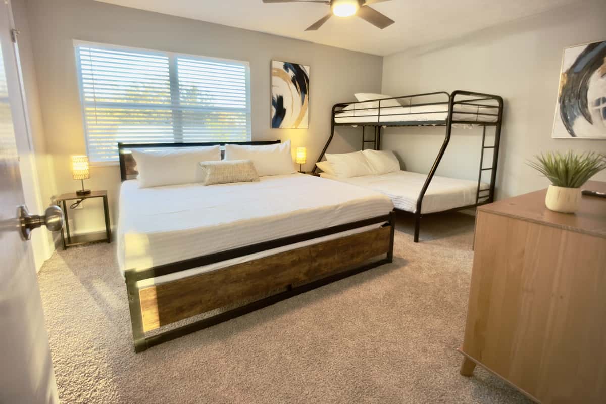 Equipped with a queen-size bed and a bunk bed, this room is perfect for kids, friends, or extra guests.