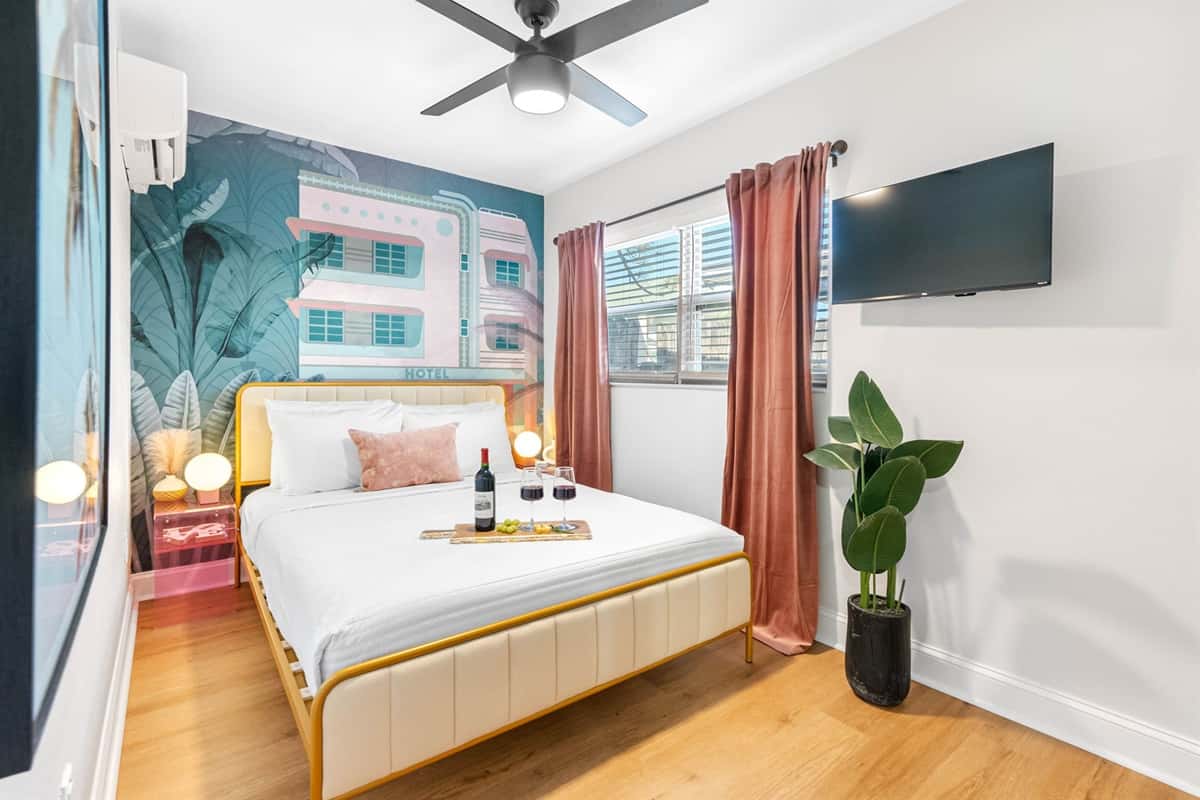 The bed is adorned with high-quality linens, including a soft, downy duvet and an array of pillows in varying degrees of firmness, ensuring a perfect night’s sleep.