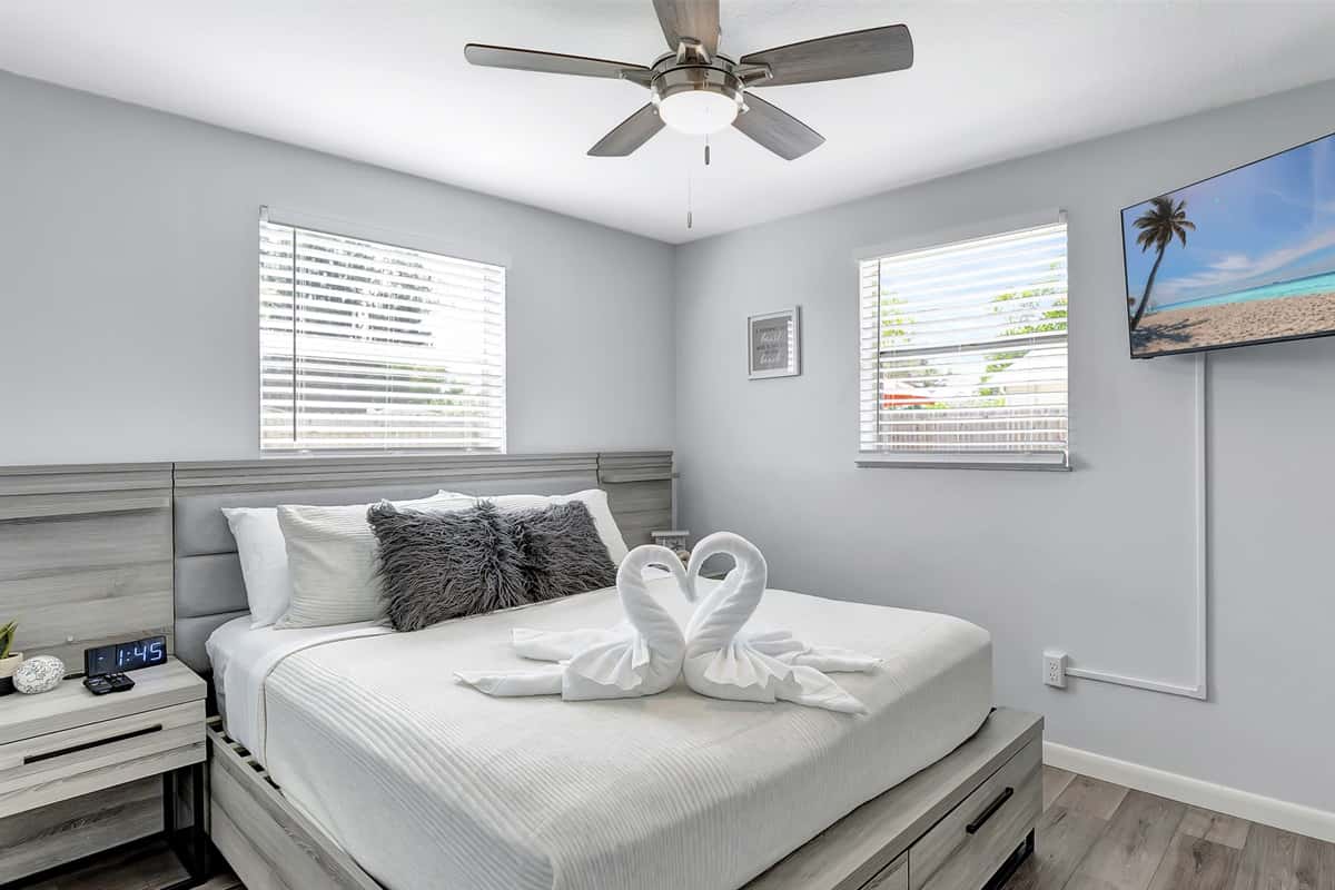 Nestled within is a plush queen-size bed, promising restful nights and lazy mornings.