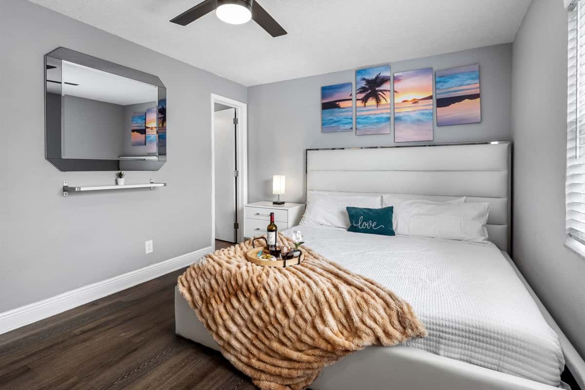 This serene bedroom combines sleek modern finishes with soft textures, creating a calming retreat ideal for rest and relaxation.