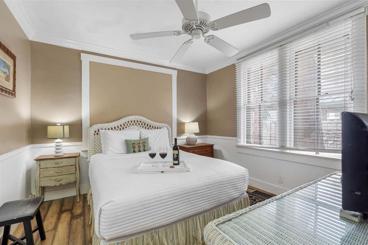 The room's design harmonizes comfort with style, featuring tasteful decor that enhances the calming ambiance.