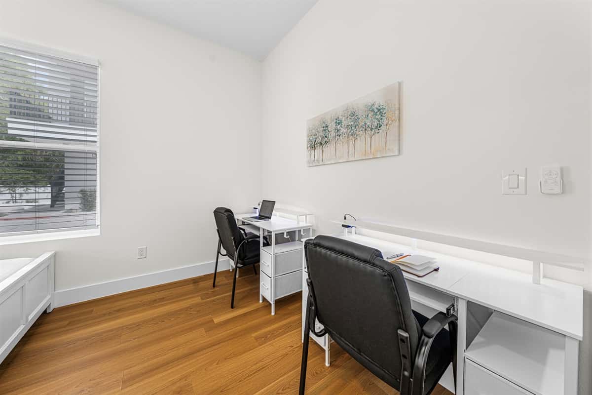 Bedroom with workspace and natural light—perfect for longer stays.
