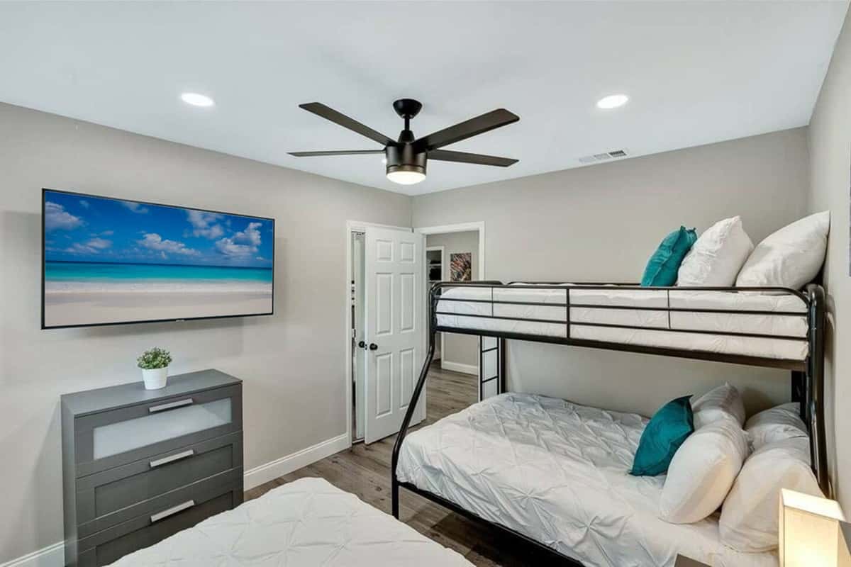 Amazing bedroom with single over twin bunkbed, queen sized bed, closets for storage and smart TV. Great room for families with kids or group of friends.