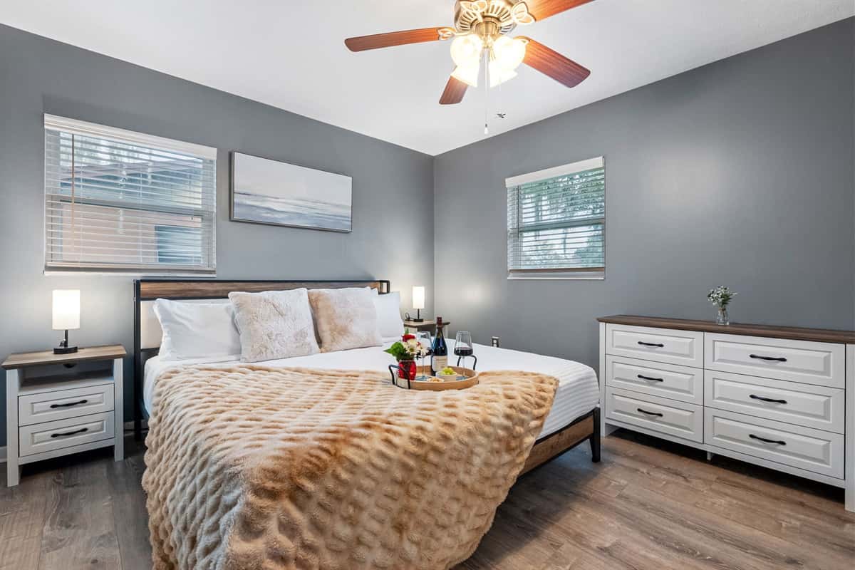 Elegant king suite featuring plush bedding and calming tones.