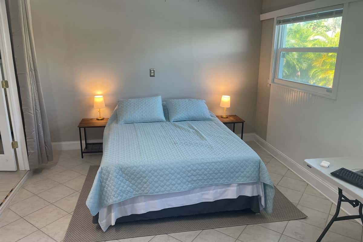 Soft lighting and plush bedding create a cozy and inviting atmosphere, ensuring a relaxing stay.
