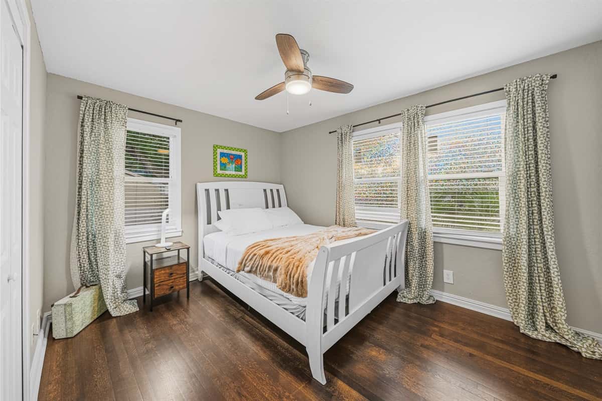 Cozy bedroom with natural light, comfortable bed, and calming decor for a restful night’s sleep.