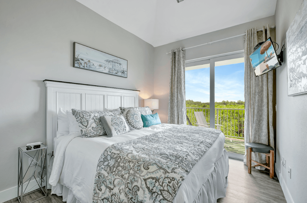 The soft linens cradle you like a cocoon, inviting you to unwind and let the worries of the day melt away.