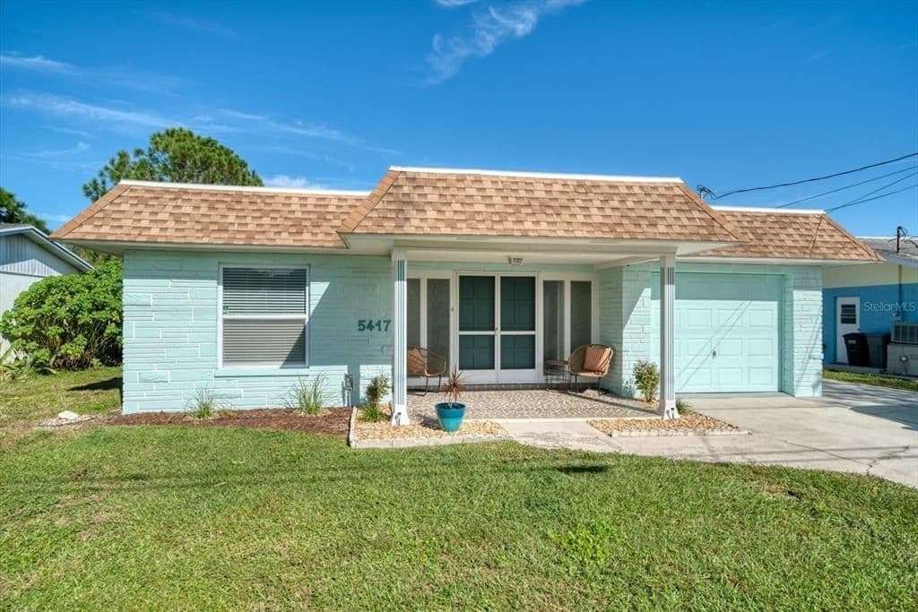 Immerse yourself in the beauty of the house's exterior and its inviting front yard.