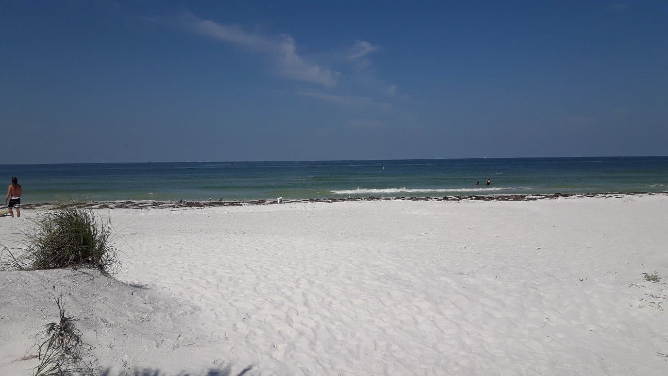 As the sky transforms into a masterpiece of vibrant colors, find a cozy spot on the beach and witness nature's breathtaking display. 