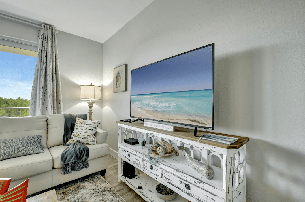 In perfect harmony with the inviting seating, a sleek TV takes its place as an unobtrusive centerpiece. 