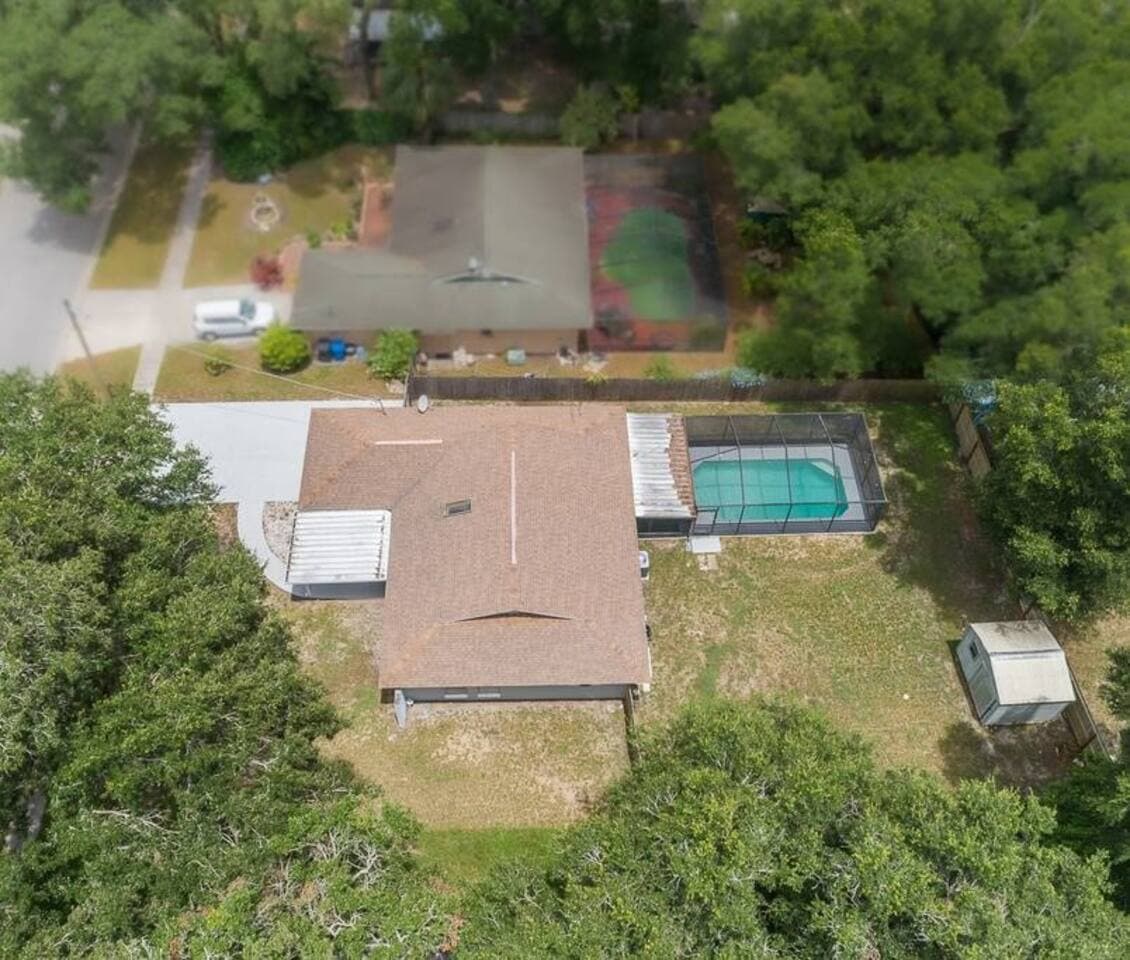 Aerial top view of our wonderful property what showcases our stunning heated pool, and beautiful driveway and our gorgeous fully fenced backyard. If you are interested in our property, send us an inquiry now!