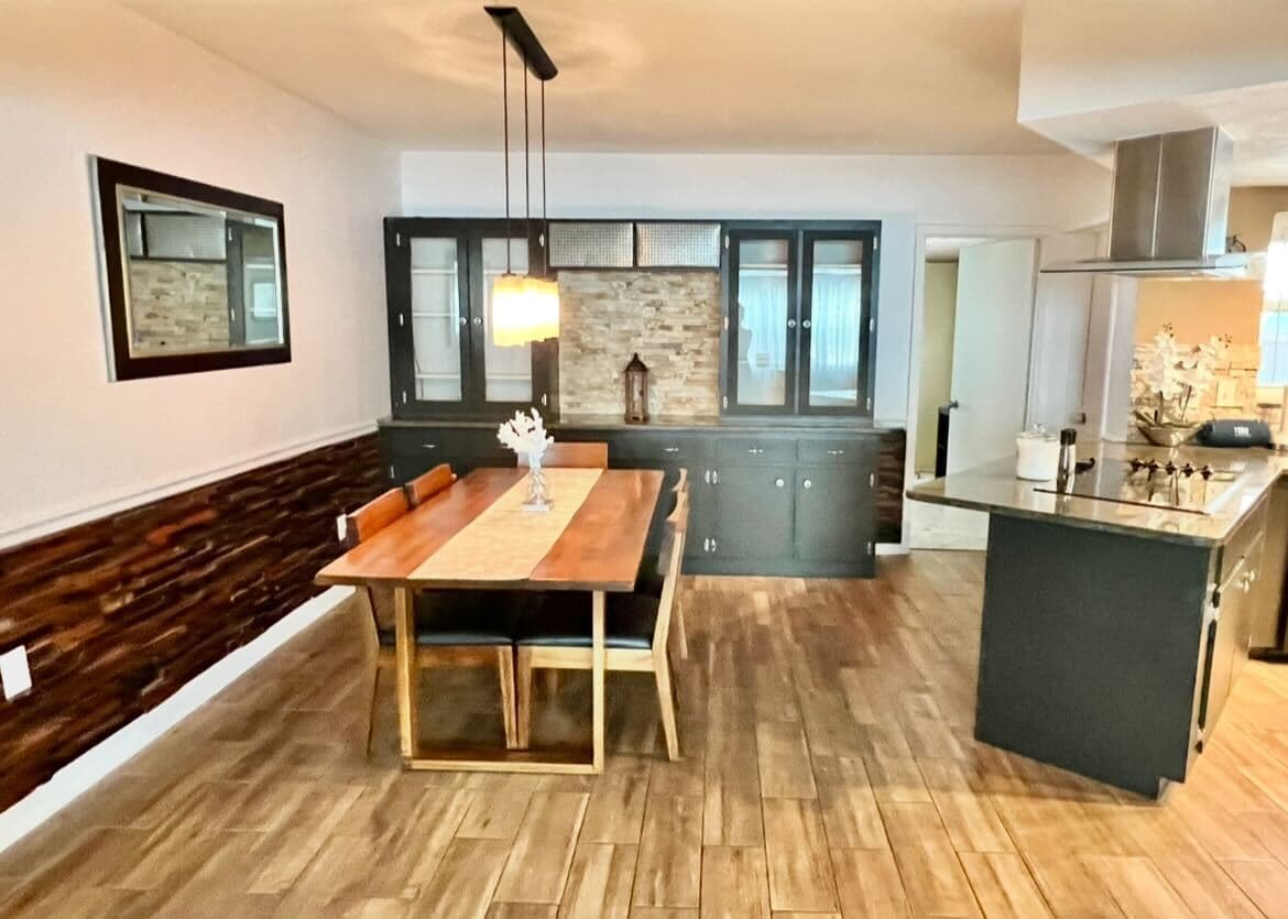 Enjoy meals together in this elegant dining space with built-in cabinetry.