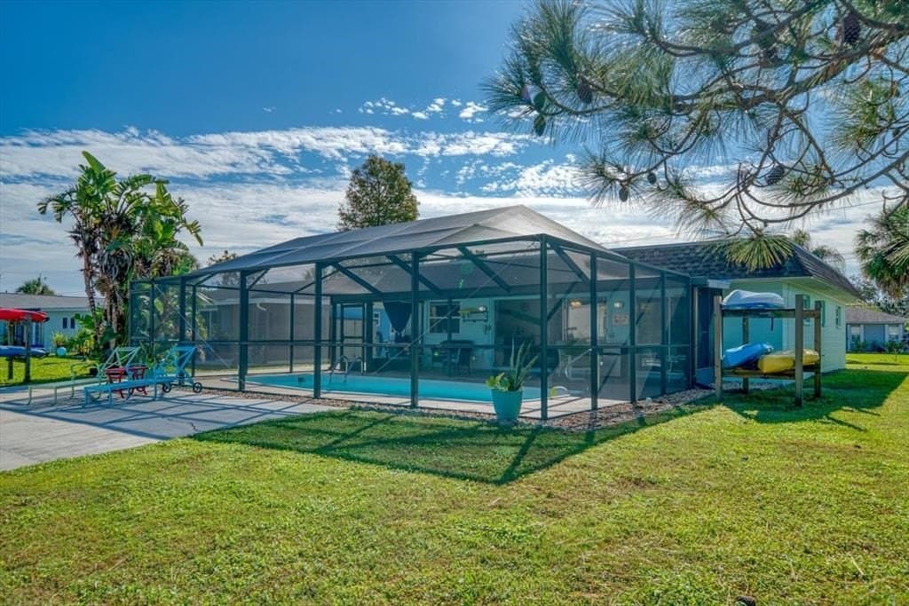 Adjacent to the pool area, a charming pathway leads to the water canal. You can take a leisurely stroll along the dock area, savoring the picturesque views and immersing yourself in the natural beauty surrounding the property.