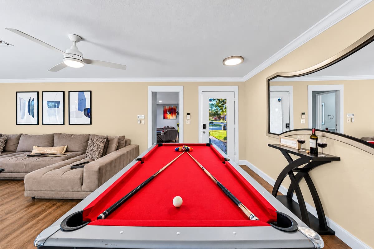 Enjoy endless fun with the pool table just steps from the living room.