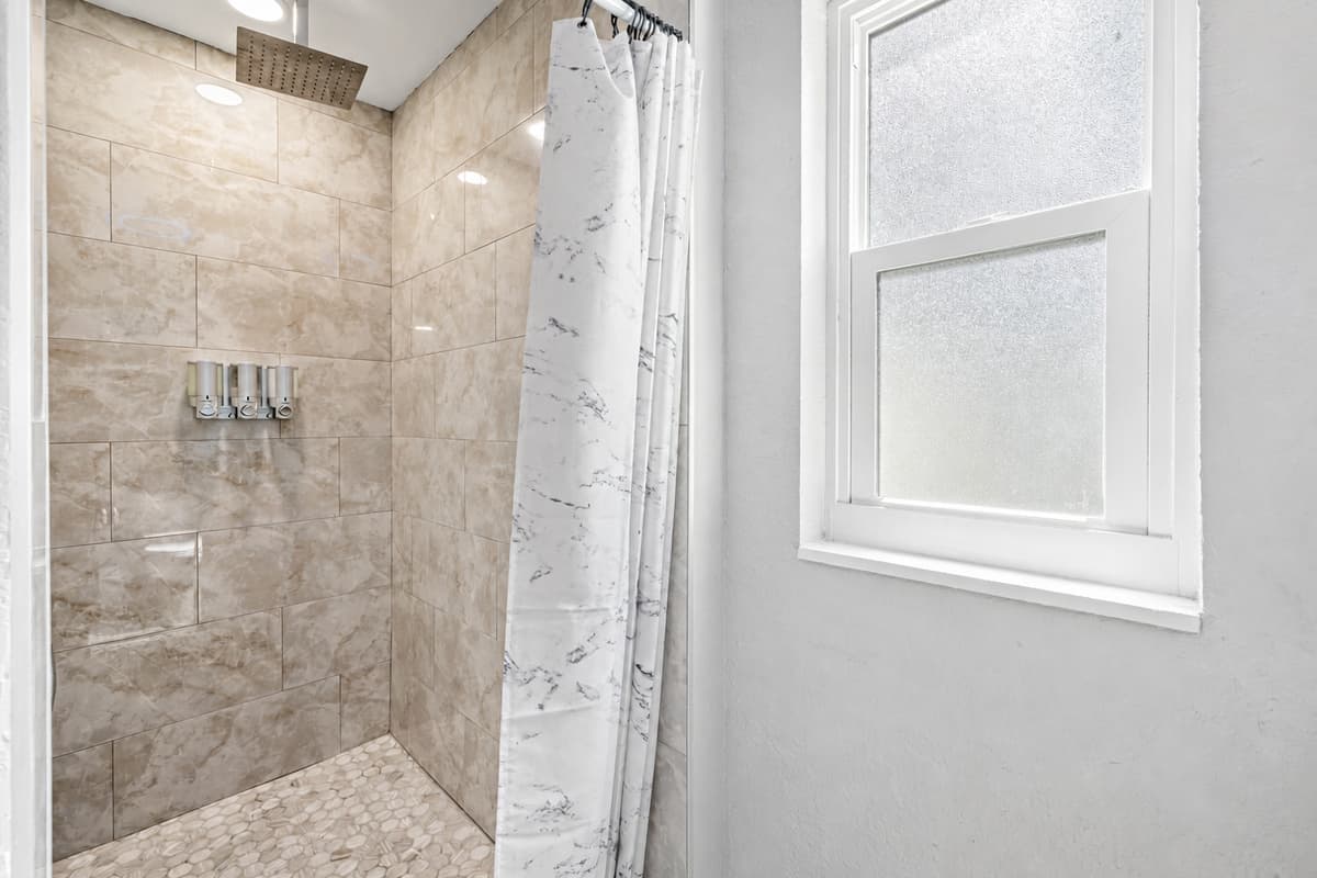 Impeccable bathroom with beautiful sink, walk in shower and toilet. Feel clean and fresh after a long day full of activities! Send us a message now!