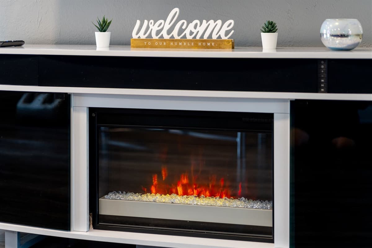 Touches like the “welcome” sign, warm lighting, and inviting decor create a homey, personalized feel amid upscale design.