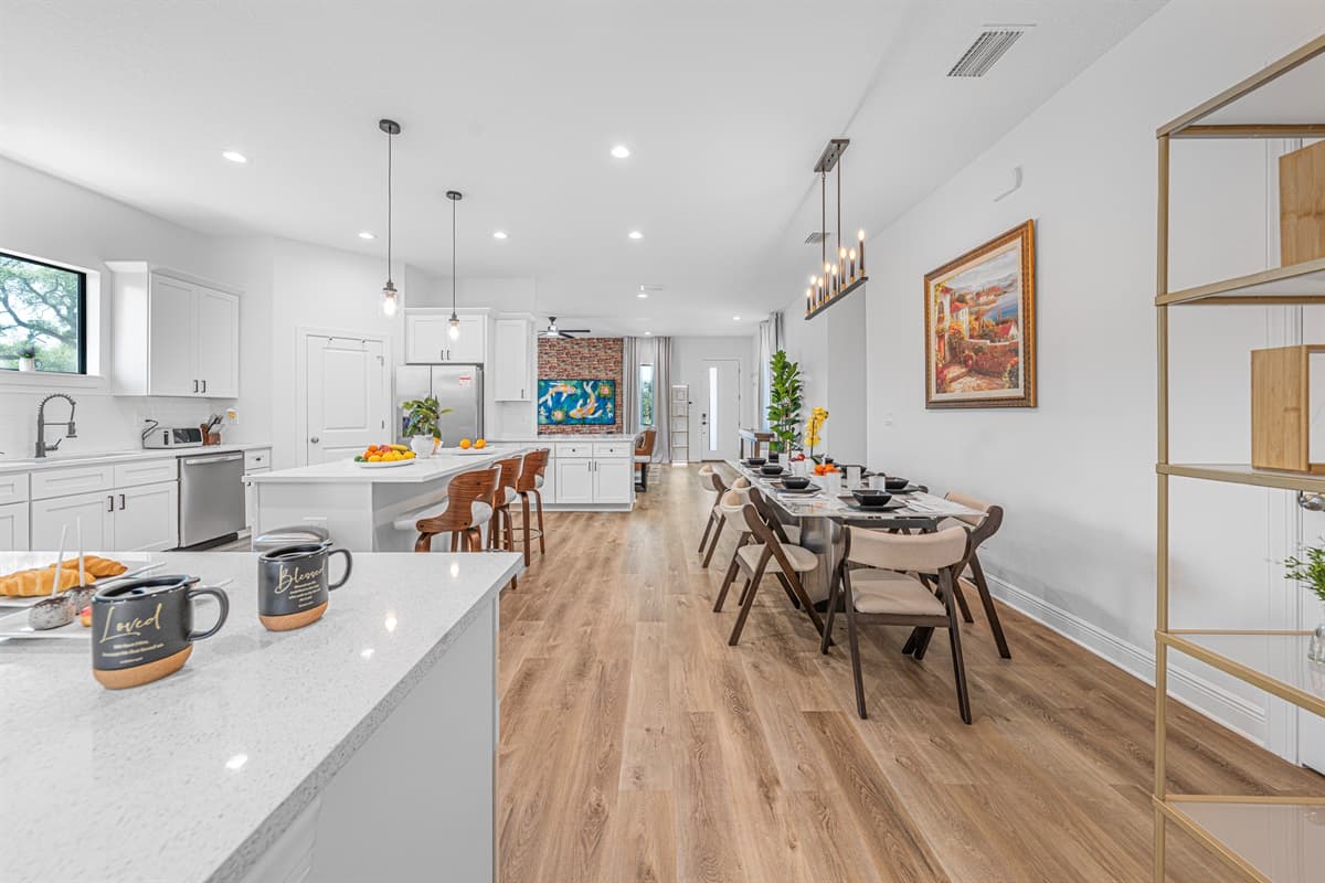 Open layout connecting kitchen and dining area, ideal for group meals and socializing.